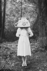 girl with large teacup on head